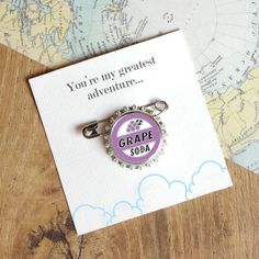 a bottle cap with the words grape soda on it and a map in the background