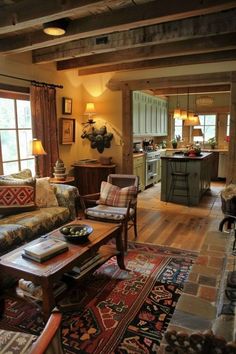 a living room filled with furniture and lots of windows