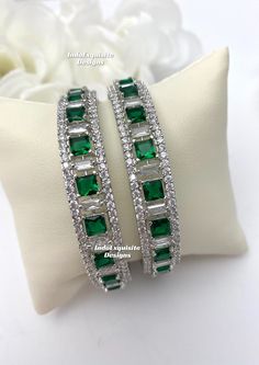 silver green American Diamond Bangles (2 pcs.) Kade/ CZ Kangan/Indian Wedding jewelry/Reception bangles set/Zircon kade All items are shipped from Brampton, Ontario, Canada. If you need your item by a certain day, please reach out to us for express delivery option before placing the order so that we can update the shipping for you. Standard shipping/delivery timeline Below are the estimated delivery times after the order is shipped/dispatched.  ---> USA delivery timeline * 4-8 business days to major urban centers in USA. It may take 2-3 days extra to remote locations ---> Canada delivery timeline  * 2-3 business days - GTA  & Montreal  * 2-4  business days - Rest of Ontario/Quebec * 4-8 business days-  Rest of Canada (Please consider 1-2 extra business days to very remote locations)    --- Green Round Bridal Sets For Wedding, Elegant Green Bangle With Stone Work, Silver Emerald Bracelets For Weddings, Green Bangle Jewelry For Anniversary, Green Bangle For Anniversary, Formal Green Emerald Bangle, Green Bangle Bracelets For Wedding, Green Cubic Zirconia Bangle For Formal Occasions, Hand-set Green Bracelets For Wedding