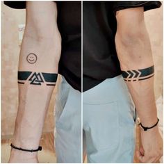 two men's armbands with tattoos on them, one has a smiley face and the other has an arrow