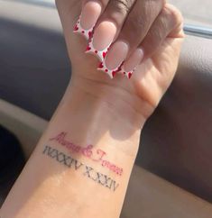 a woman's arm with red and white polka dots on it that says, happy new year