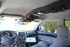 the interior of a car with dashboard and dash lights, steering wheel controls and electronic equipment