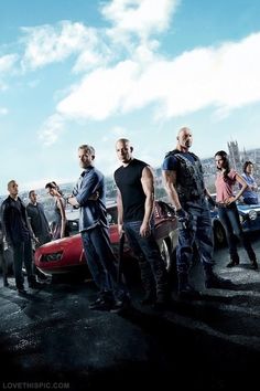 the fast and the furious movie poster with some people standing in front of a car