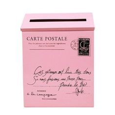 a pink post box with a handwritten note on it's front and bottom