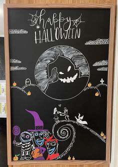 a chalk board with halloween pictures on it