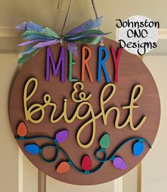 a merry and bright sign hanging on the front door