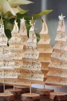 small wooden christmas trees with musical notes on them