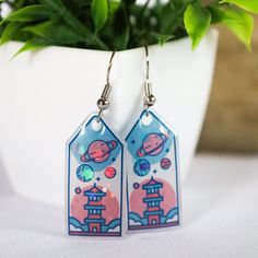 Blast off into your own kawaii universe with these adorable earrings! Bring all the ethereal vibes with you wherever you wander <3 ~ Handmade by yours truly, these little cuties feature a glitter resin inlay and will bring a shine into any room!  Made with all the love! Handmade Space-themed Earrings For Gift, Handmade Space-themed Earrings As Gift, Magical Nickel-free Earrings For Gifts, Nickel-free Magical Earrings For Gift, Blue Kawaii Earrings For Gift, Kawaii Hypoallergenic Earrings As Gift, Kawaii Hypoallergenic Earrings For Gift, Hypoallergenic Kawaii Earrings As Gift, Space-themed Drop Earrings As Gift