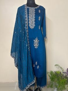 Silk Blend Navy Blue Embroidered Straight Kurta With Trousers and Dupatta Indian Wedding Wear Salwar Kameez / Indian Wedding Dress / Plus Size Cotton Kurta Dress Traditional Indian Wear / Salwar Kameez Dupatta / Kurti Palazzo Set The set contains: 1 Straight Kurta 1 Trousers 1 Dupatta Kurta: The navy blue straight Kurta has a round neck design with sequinned work details in front. The Kurta measures till calf length and has straight hemline. Sleeve length :  3/4 Sleeves Sharara :  Solid trousers Transitional Party Kurta With Gota Work, Embroidered Palazzo Set With Straight Kurta For Party, Party Palazzo Set With Embroidered Straight Kurta, Blue Traditional Wear With Dabka Work For Wedding, Blue Embroidered Anarkali Set For Festive Occasions, Festive Blue Embroidered Anarkali Set, Blue Traditional Wear With Resham Embroidery For Party, Blue Art Silk Churidar With Self Design, Fitted Blue Traditional Wear For Festive Occasions