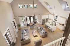 an aerial view of a living room and kitchen area in a house with high ceilings