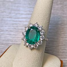 Absolutely stunning Zambian emerald 18k white gold ring! The emerald is from Zambia, beautiful rich green color and good clarity for its size. There are 1.77 carats of sparkly white diamonds adorning the ring! This ring comes with one certification: Gemological Institute of America (GIA) Ring Size: 7 Total Weight: 6.21 grams Precious Metal: 18k gold Precious stones: -Emerald Center Stone: 4.26 carats, 12.1mm x 9.5mm -White Diamonds: 1.77 carats Hallmark: 750 CS 4.26 D1.77 Dazzling Silver Emerald Ring Gia Certified, Luxury Gia Certified Dazzling Emerald Ring, Luxury Dazzling Green Emerald Ring, Zambian Emerald Ring, Luxury Gia Certified Pear-shaped Emerald Ring, Zambian Emerald, Solid Gold Rings, Emerald Diamond, White Gold Rings