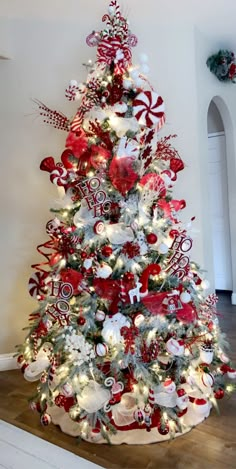 a christmas tree decorated with red and white ornaments