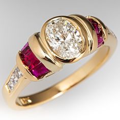 a yellow gold ring with pink and white stones