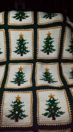 a crocheted christmas tree afghan is shown