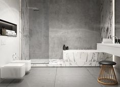 a modern bathroom with marble walls and flooring