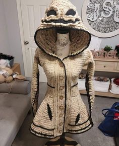 a mannequin wearing a jacket made out of knits