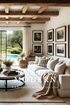 a living room filled with lots of furniture and pictures on the wall above it's windows