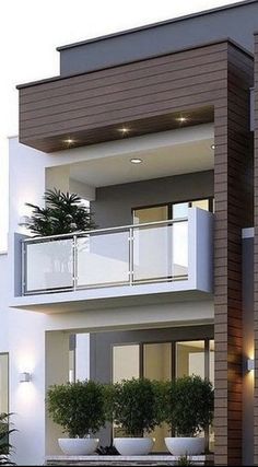 an exterior view of a two story house with balconies and potted plants