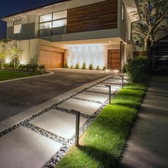 a modern house at night with lights on