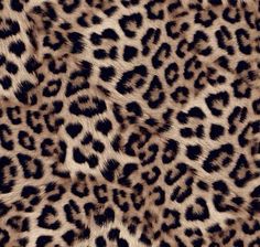 an animal print fabric with black and brown spots