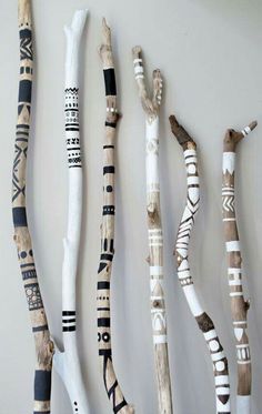 several pieces of art made out of sticks