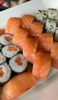 sushi platter with salmon, cauliflower and cucumbers