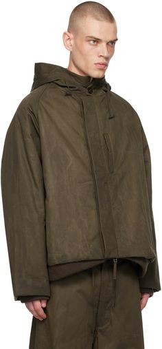 Padded waxed cotton canvas jacket. · Drawstring at hood · Two-way zip closure · Button closure · Welt pockets · Rib knit hem and cuffs · Full plain-woven wool lining Supplier color: Dark moss waxed cotton Tanker Jacket, Canvas Jacket, Waxed Cotton, Welt Pockets, Welt Pocket, Rib Knit, Cotton Canvas, Wool, Knitting