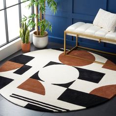 a living room area with blue walls and black, white, and brown rugs