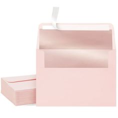 pink envelopes with white paper sticking out of them