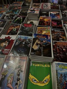 a large amount of comic books are on display