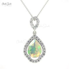 Description This superb opal art deco diamond pendant is so eye-catching makes everyone fall in love with it. The pendant displays a pear cut opal 8x6mm in the center that sets in prong settings. Made with startling 14k solid gold and adorned with 0.14CT of shining diamonds in a bead setting, it'll make her eyes lit when she opens our fancy box. The quality of the opal is AAA and, it is the birthstone of October. The pretty soothing tones of opal will make her heart smile and shine! The gold cha Elegant Drop Opal Jewelry, Fine Jewelry Opal Pendant, Formal Pear-shaped Opal Jewelry, Pear-shaped Opal Jewelry For Formal Occasions, Formal Opal Pear-shaped Jewelry, Formal Teardrop Opal Pendant Jewelry, Elegant Pear-shaped Opal Jewelry, Formal Opal Teardrop Pendant Jewelry, White Opal Pendant Jewelry