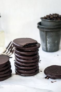 chocolate cookies are stacked on top of each other