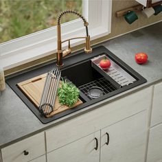 the kitchen sink is clean and ready to be used as a dishwasher or drainer