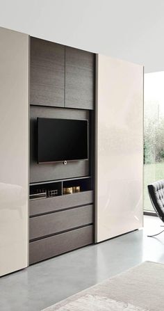 a modern living room with a large tv on the wall