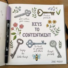 an open notebook with keys to contentment written on the pages and surrounded by flowers