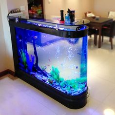 a fish tank is sitting on top of a counter