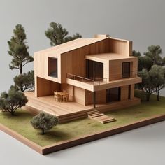 a model of a house with trees and grass