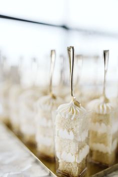 small desserts are lined up on a tray