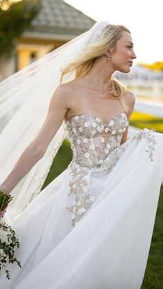 a woman in a wedding dress holding a bouquet