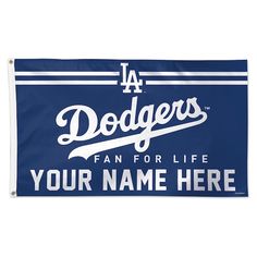 a los angeles dodgers fan for life banner hanging on a wall in front of a white background