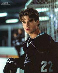 a young man is posing for a hockey photo