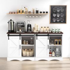 a coffee bar with shelves, cups and other items on the wall behind it in a white room