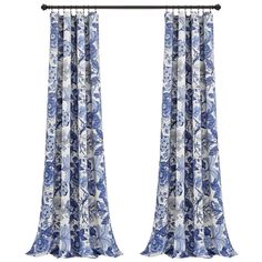 blue and white curtains with floral designs on them