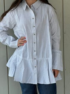 Made from 100% cotton, the Brynlee Ruffle Tunic Shirt is perfect for any season. Its lightweight material and cuffed sleeves provide both comfort and style. The versatile design features a ruffle bottom and can be worn open or closed with buttons down the front. Elevate your wardrobe with this striped must-have! Measurements S: bust 40" length 29" shoulders 15" M: bust 44" length 31" shoulders 16" L: bust 48" length 33" shoulders 17"