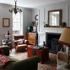 a living room filled with furniture and a fire place