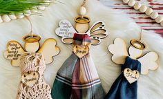 three wooden angel ornaments on a white furnishing