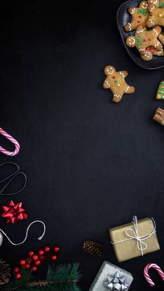 christmas cookies and presents on a black background