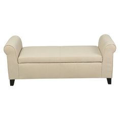 a cream colored bench with black legs on a white background