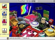 the computer screen shows an image of various objects and colors, including a rainbow in the background