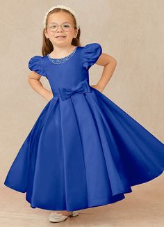 Have your flower girl dressed to impress your friends and family while she wears our matte satin little ballgown, Jewel. Her neckline is jeweled with hand sewn beading, puff sleeves, and a beautiful bow belt that sits atop a full box-pleat tea length skirt. We have matching pearls at the sleeves and a removable back bow. Royal Blue Quinceanera Dresses With Bow, Royal Blue Dresses For Kids, Blue Dresses For Kids, Royal Blue Dress Kids, Ball Dresses For Kid Blue, Royal Blue Flower Girl Dress, Royal Blue Flowergirl Dress, Royal Blue Ball Gown, Satin Flower Girl Dresses